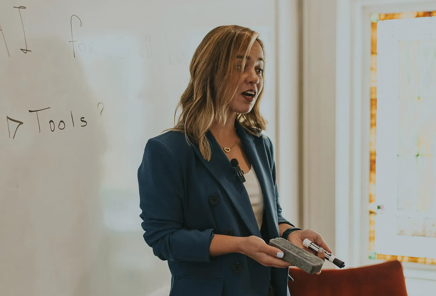 Kam giving a presentation about AI to a group of students